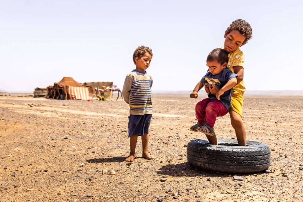Children play in the desert