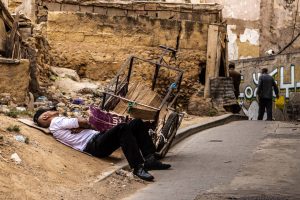 Man resting in the street